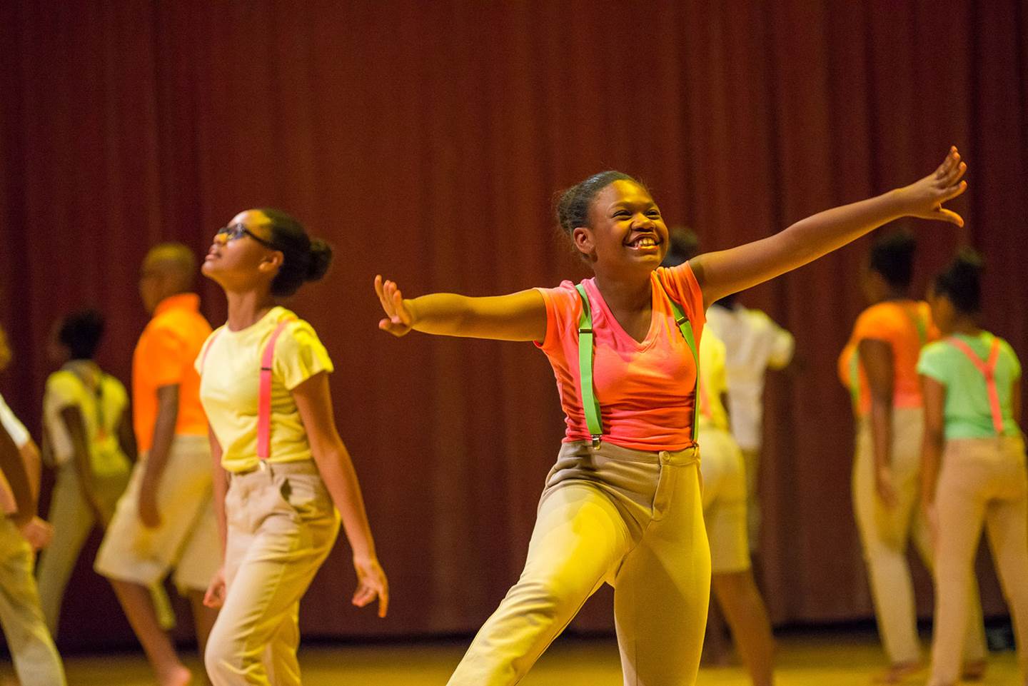 AileyCamp Miami dancers on stage smiling.